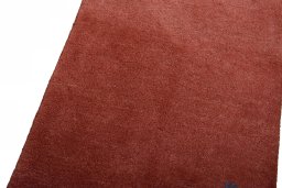 Backside of handmade New Persian Gabbeh rug showing knot structure and weave density
