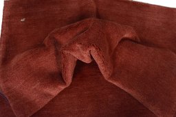Corner detail of New Persian Gabbeh rug showing border pattern and Wool pile