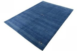 Corner detail of New Persian Gabbeh rug showing border pattern and Wool pile