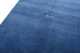 Backside of handmade New Persian Gabbeh rug showing knot structure and weave density