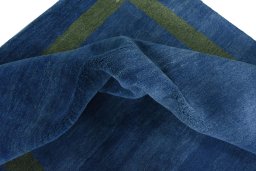Corner detail of New Persian Gabbeh rug showing border pattern and Wool pile