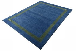 Corner detail of New Persian Gabbeh rug showing border pattern and Wool pile