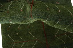 Corner detail of New Persian Gabbeh rug showing border pattern and Wool pile