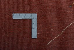 Corner detail of New Persian Gabbeh rug showing border pattern and Wool pile