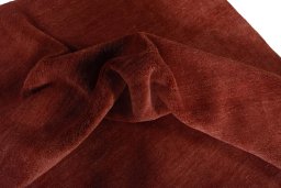 Corner detail of New Persian Gabbeh rug showing border pattern and Wool pile