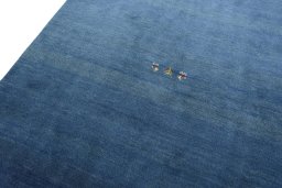 Backside of handmade New Persian Gabbeh rug showing knot structure and weave density