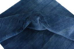 Corner detail of New Persian Gabbeh rug showing border pattern and Wool pile