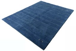 Corner detail of New Persian Gabbeh rug showing border pattern and Wool pile