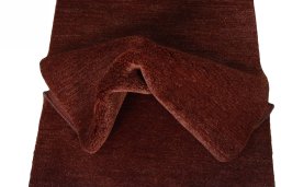 Corner detail of New Persian Gabbeh rug showing border pattern and Wool pile