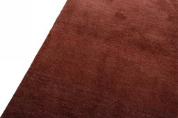 Backside of handmade New Persian Gabbeh rug showing knot structure and weave density