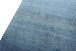 Backside of handmade New Persian Gabbeh rug showing knot structure and weave density