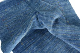 Corner detail of New Persian Gabbeh rug showing border pattern and Wool pile