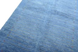 Backside of handmade New Persian Gabbeh rug showing knot structure and weave density