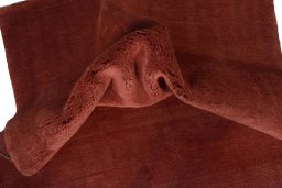 Corner detail of New Persian Gabbeh rug showing border pattern and Wool pile