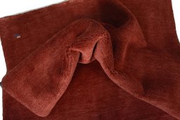 Corner detail of New Persian Gabbeh rug showing border pattern and Wool pile