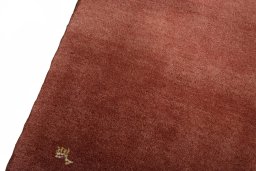 Backside of handmade New Persian Gabbeh rug showing knot structure and weave density