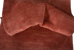 Corner detail of New Persian Gabbeh rug showing border pattern and Wool pile