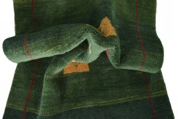 Corner detail of New Persian Gabbeh rug showing border pattern and Wool pile