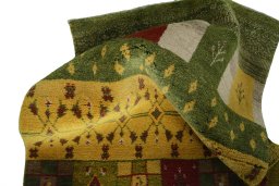Corner detail of New Persian Gabbeh rug showing border pattern and Wool pile