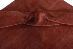 Corner detail of New Persian Gabbeh rug showing border pattern and Wool pile
