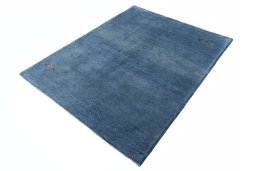 Corner detail of New Persian Gabbeh rug showing border pattern and Wool pile