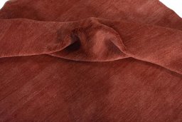 Corner detail of New Persian Gabbeh rug showing border pattern and Wool pile