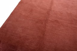 Backside of handmade New Persian Gabbeh rug showing knot structure and weave density