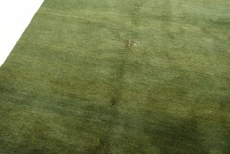 Backside of handmade New Persian Gabbeh rug showing knot structure and weave density