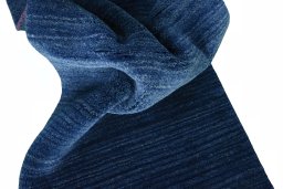 Corner detail of New Persian Gabbeh rug showing border pattern and Wool pile