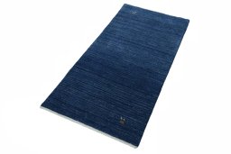 Corner detail of New Persian Gabbeh rug showing border pattern and Wool pile