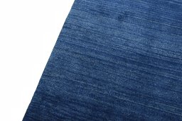 Backside of handmade New Persian Gabbeh rug showing knot structure and weave density