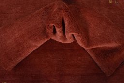 Corner detail of New Persian Gabbeh rug showing border pattern and Wool pile