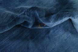 Corner detail of New Persian Gabbeh rug showing border pattern and Wool pile