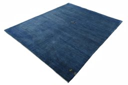 Corner detail of New Persian Gabbeh rug showing border pattern and Wool pile