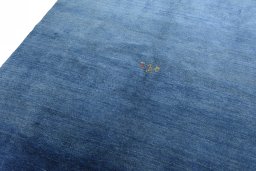 Backside of handmade New Persian Gabbeh rug showing knot structure and weave density