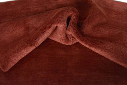 Corner detail of New Persian Gabbeh rug showing border pattern and Wool pile