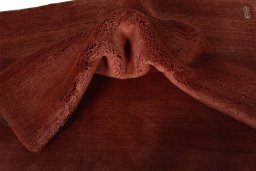 Corner detail of New Persian Gabbeh rug showing border pattern and Wool pile