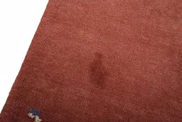 Backside of handmade New Persian Gabbeh rug showing knot structure and weave density