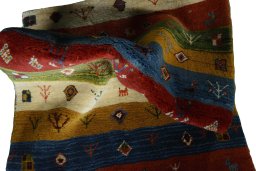 Corner detail of New Persian Gabbeh rug showing border pattern and Wool pile
