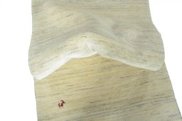 Corner detail of New Persian Gabbeh rug showing border pattern and Wool pile