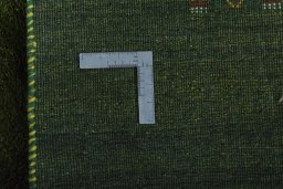 Close-up detail of New Persian Gabbeh rug from Iran / Persia showing Wool weave