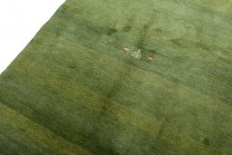 Backside of handmade New Persian Gabbeh rug showing knot structure and weave density