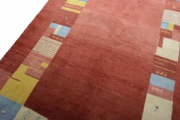Backside of handmade New Persian Gabbeh rug showing knot structure and weave density