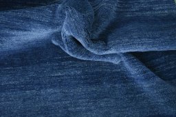 Corner detail of New Persian Gabbeh rug showing border pattern and Wool pile
