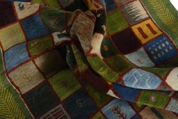 Corner detail of New Persian Gabbeh rug showing border pattern and Wool pile