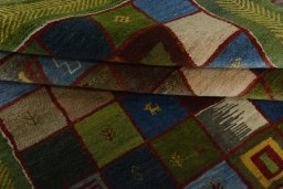 Full view of New Persian Gabbeh rug from Iran / Persia, 247 × 175 cm in Multi Color tones
