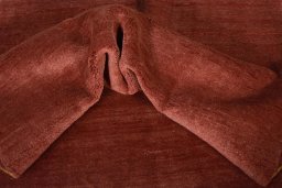 Corner detail of New Persian Gabbeh rug showing border pattern and Wool pile