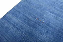 Backside of handmade New Persian Gabbeh rug showing knot structure and weave density