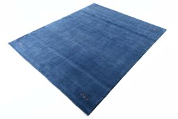 Corner detail of New Persian Gabbeh rug showing border pattern and Wool pile