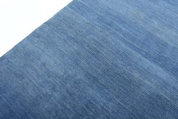 Backside of handmade New Persian Gabbeh rug showing knot structure and weave density
